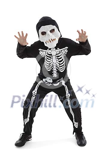 Isolated boy dressed as a skeleton