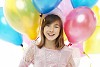 Girl with a bunch of balloons
