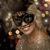 Masked woman on a sparkling background