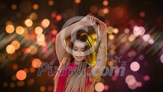 Woman dancing on a lighted background