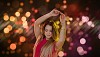 Woman dancing on a lighted background