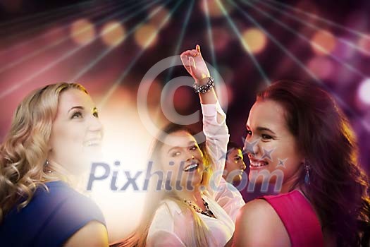Three women dancing in the club