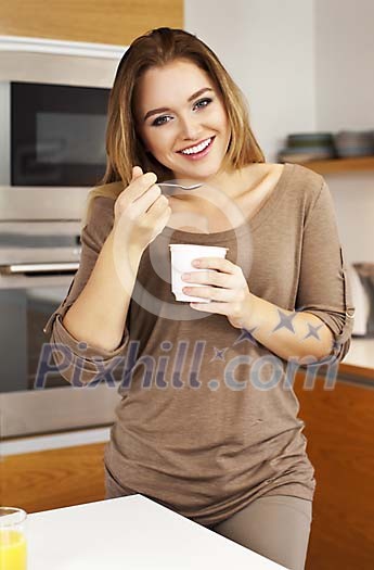 Woman eating youghurt Woman eating youghurt