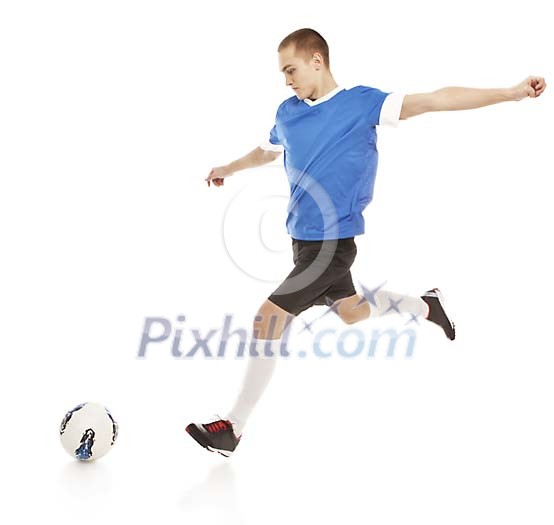 Isolated male footballer going to kick the ball