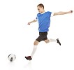 Isolated male footballer going to kick the ball