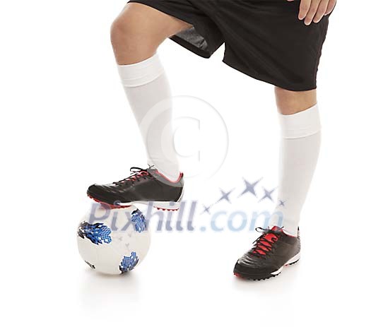 Isolated male feet with a football