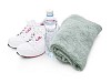 Isolated running shoes with a bottle of water and a towel