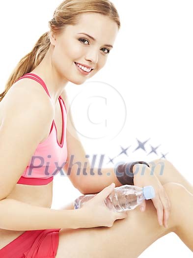 Woman sitting and holding a water bottle