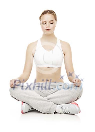 Isolated female meditating on the floor Isolated female meditating on the floor