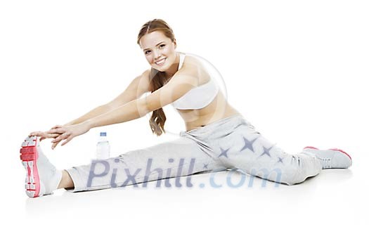 Isolated female stretching on the floor Isolated female stretching on the floor