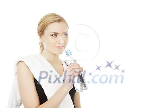 Female starting to dring water from a bottle Female starting to dring water from a bottle