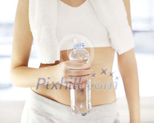 Woman holding a bottle of water