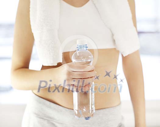 Woman holding a bottle of water Woman holding a bottle of water