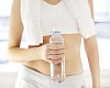 Woman holding a bottle of water