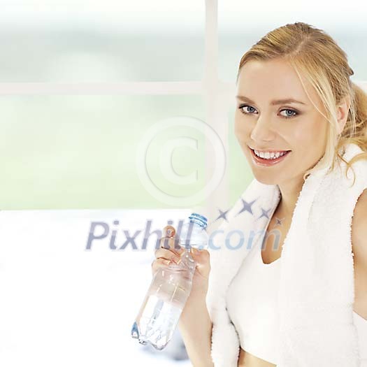 Woman holding a bottle of water