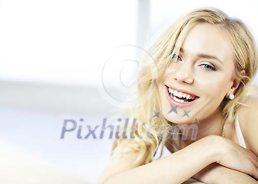 Woman smiling to the camera Woman smiling to the camera
