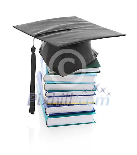 Isolated pile of books with a graduate cap