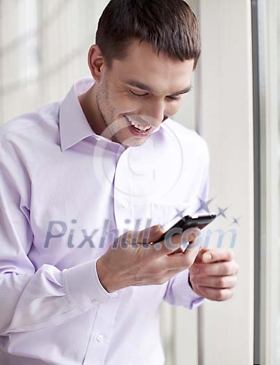 Businessman smiling with a phone