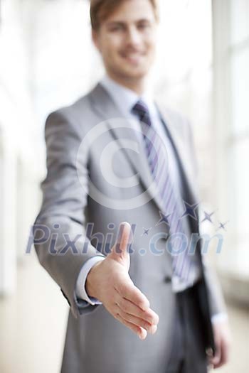 Businessman offering his hand to shake
