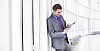 Businessman looking at his tablet computer