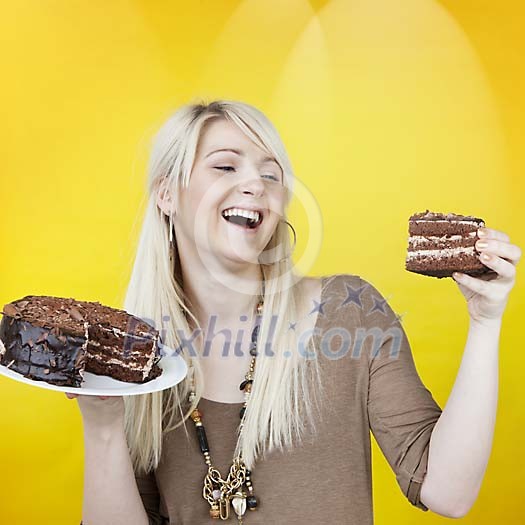Smiling woman with a chocolate cake