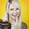 Woman with a chocolate cake on her finger