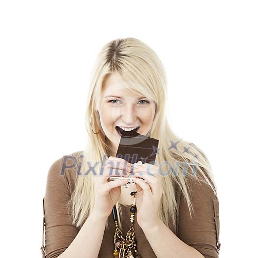 Woman taking a bite of the chocolate bar Woman taking a bite of the chocolate bar