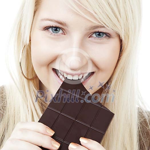 Woman taking a bite of chocolate Woman taking a bite of chocolate