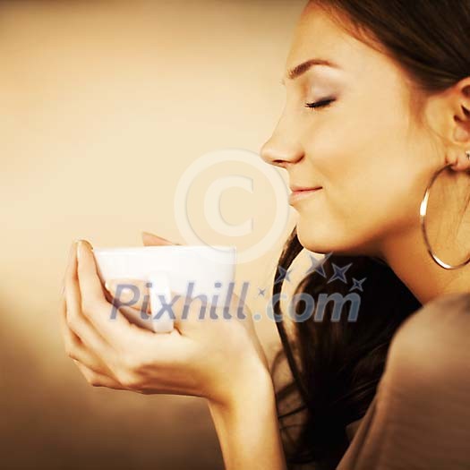 Woman holding a cup of cocoa Woman holding a cup of cocoa