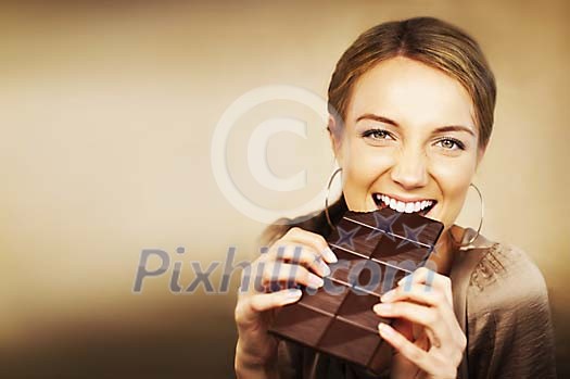 Woman eating chocolate Woman eating chocolate