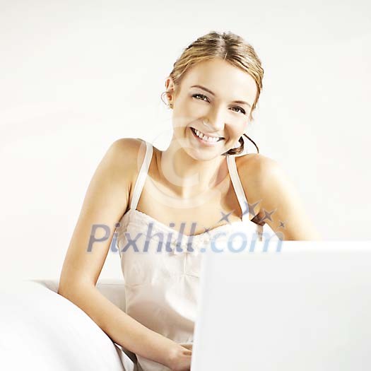 Smiling woman with a laptop