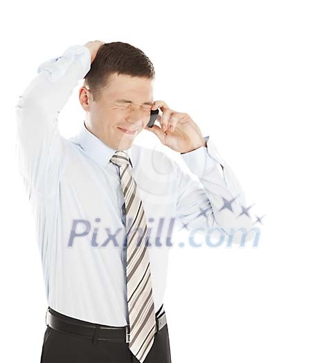 Isolated businessman getting bad news over the phone Isolated businessman getting bad news over the phone