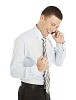Isolated businessman getting good news over the phone