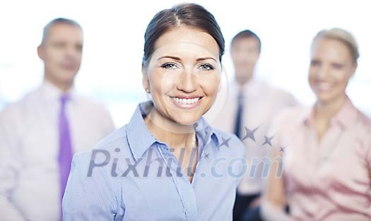 Smiling businesswoman with assosiates