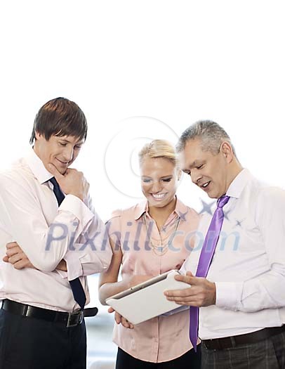 Business people looking at the tablet computer