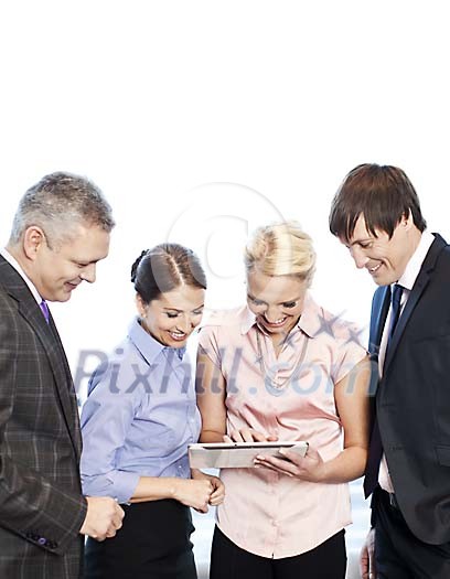 Smiling business people looking at the tablet computer