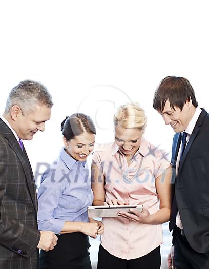 Smiling business people looking at the tablet computer Smiling business people looking at the tablet computer
