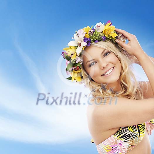 Sensitive Scandinavian girl smiling to camera wearing a colorful floral head wreath Sensitive Scandinavian girl smiling to camera wearing a colorful floral head wreath