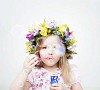 Summery girl blowing soap bubbles