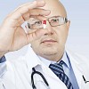 Male doctor holding a medicine capsule