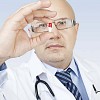 Male doctor holding a medicine capsule