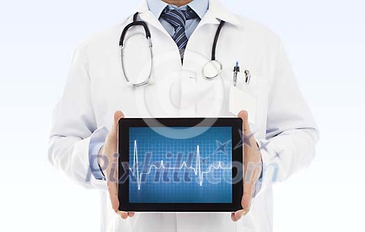 Male doctor holding a tablet computer with heartbeat line on the screen