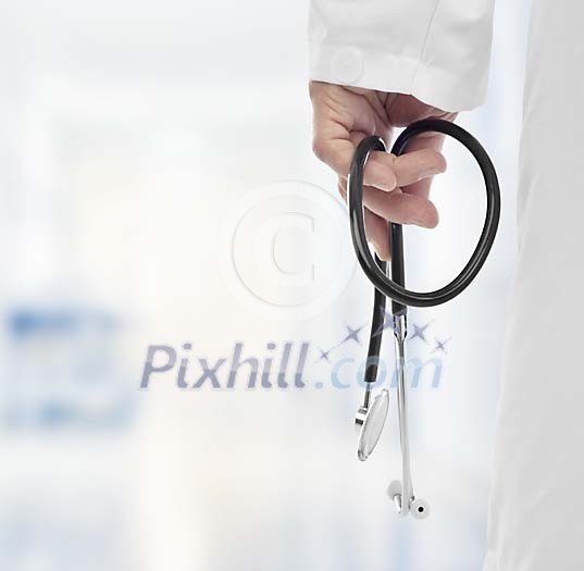 Male doctor holding a stetoscope