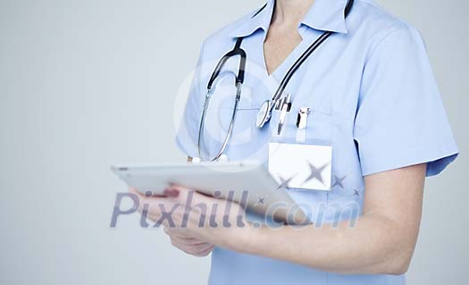 Female nurse with a tablet computer