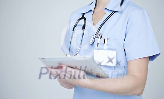 Female nurse with a tablet computer Female nurse with a tablet computer