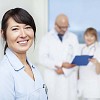 Smiling nurse with a doctor and another nurse