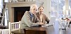 Senior couple using laptop at home