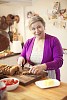 Senior woman preparing breakfast in the kitchen