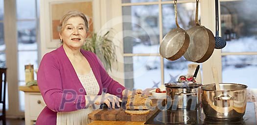 Senior female cooking in the kitchen