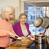 Senior couple cooking together in the kitchen